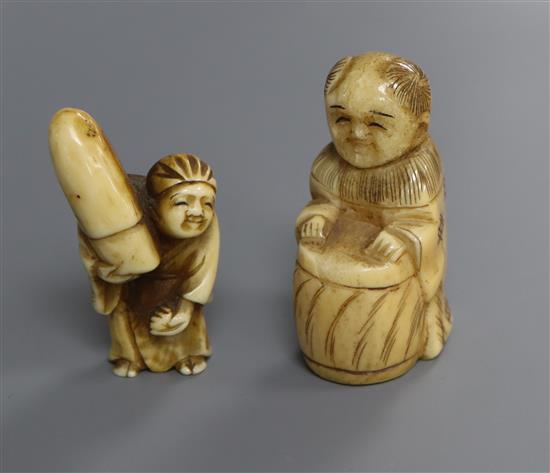 A Japanese ivory netsuke of a walrus and another of a man